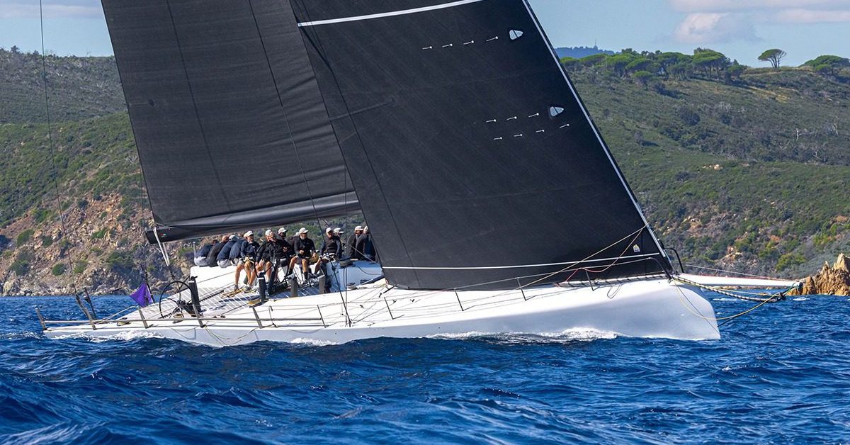May be an image of 3 people, people boat racing, sailing boat, sail and text