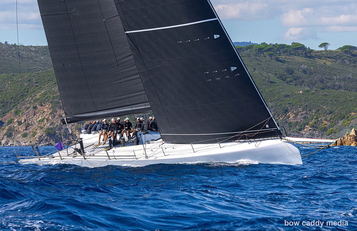 May be an image of 3 people, people boat racing, sailing boat, sail and text