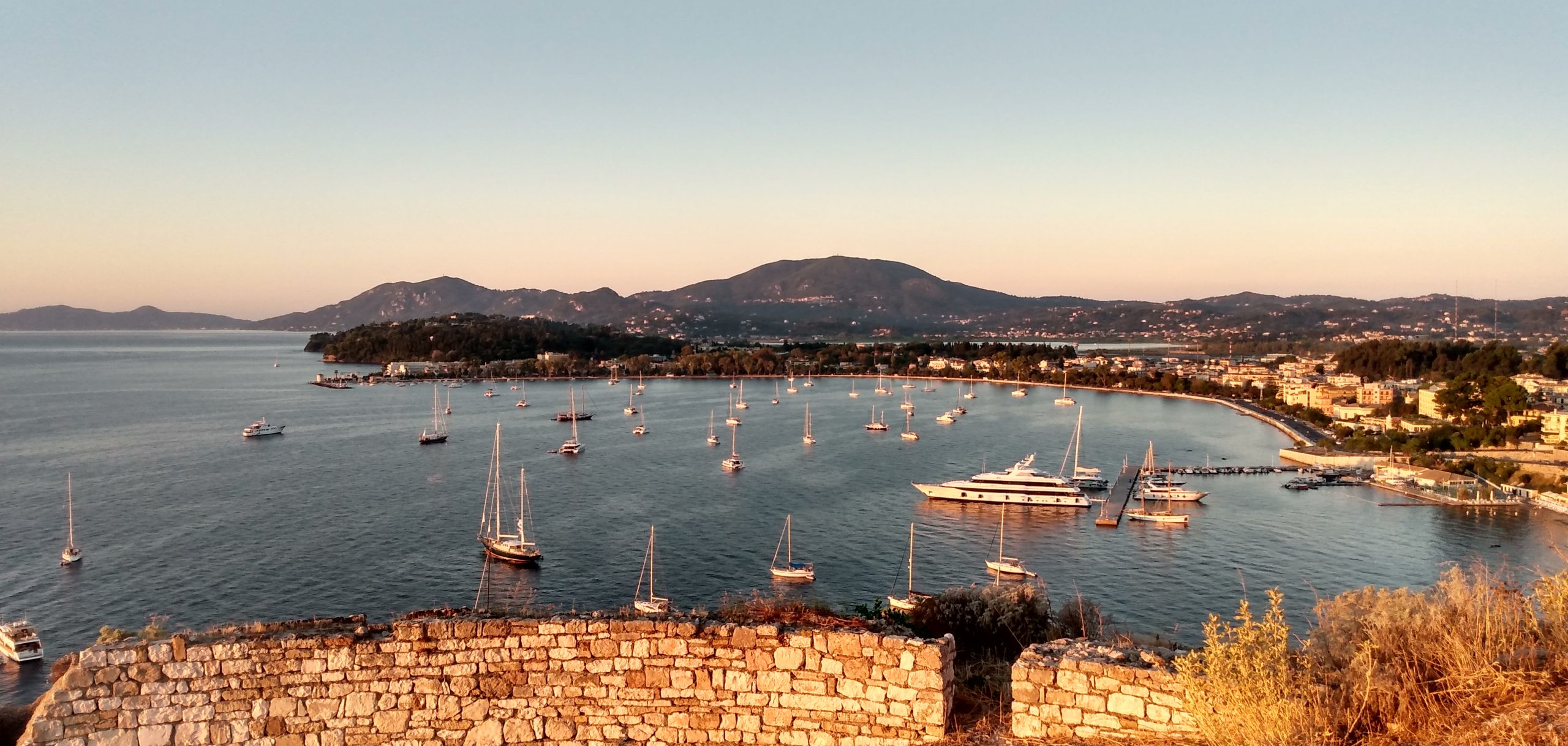 Yachts at anchor off Corfu Town at sunrise