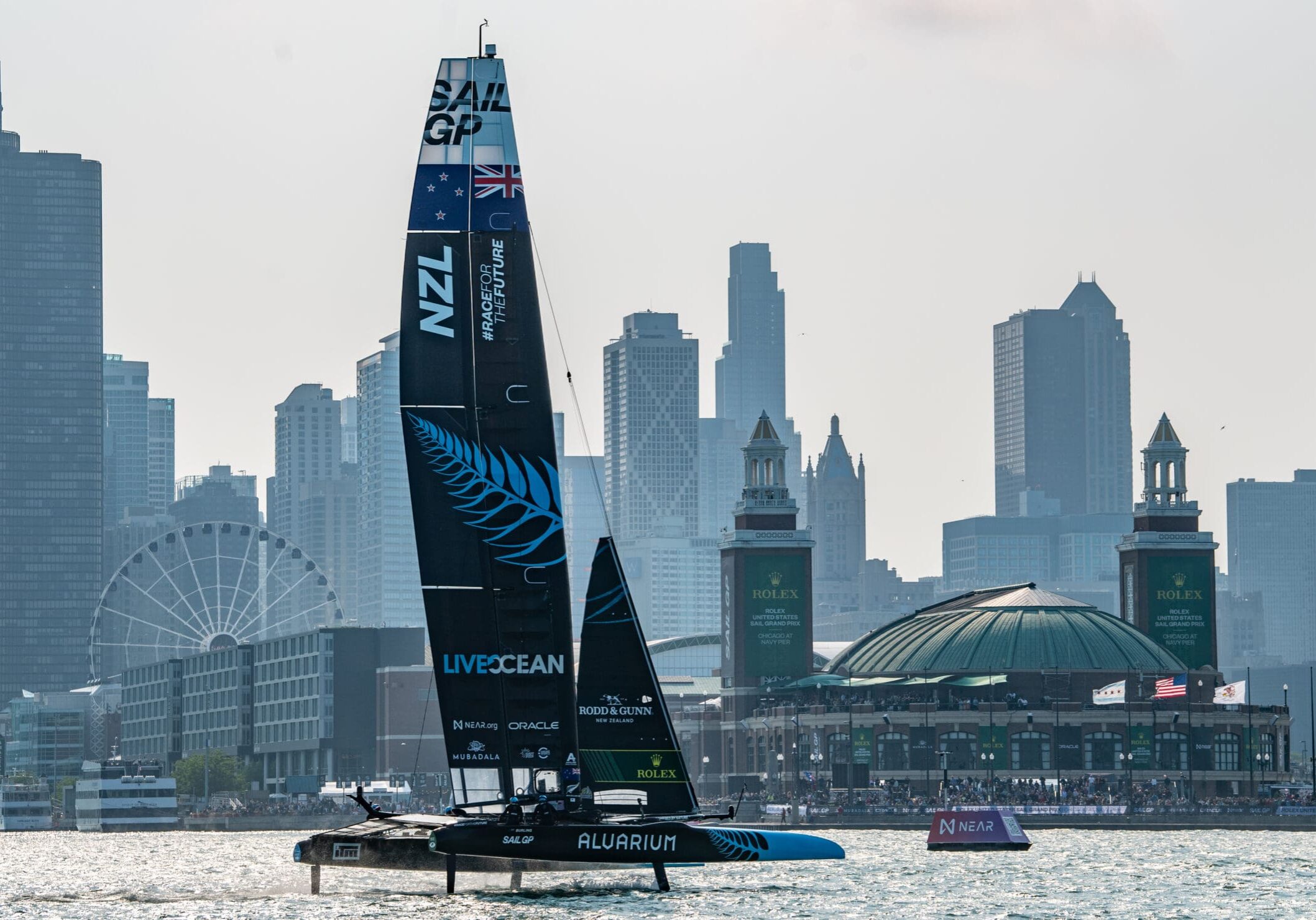 New Zealand SailGP Team helmed by Peter Burling sail toward Navy Pier on Race Day 1 of the Rolex United States Sail Grand Prix | Chicago at Navy Pier, Season 4, in Chicago, Illinois, USA. 16th June 2023. Photo: Ricardo Pinto for SailGP. Handout image supplied by SailGP